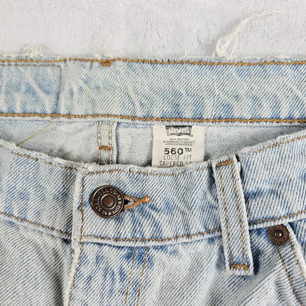 Vtg Levi's 560 Orange Tab Jeans 34x29 90s USA Loose Tapered Light Wash Raw Hem